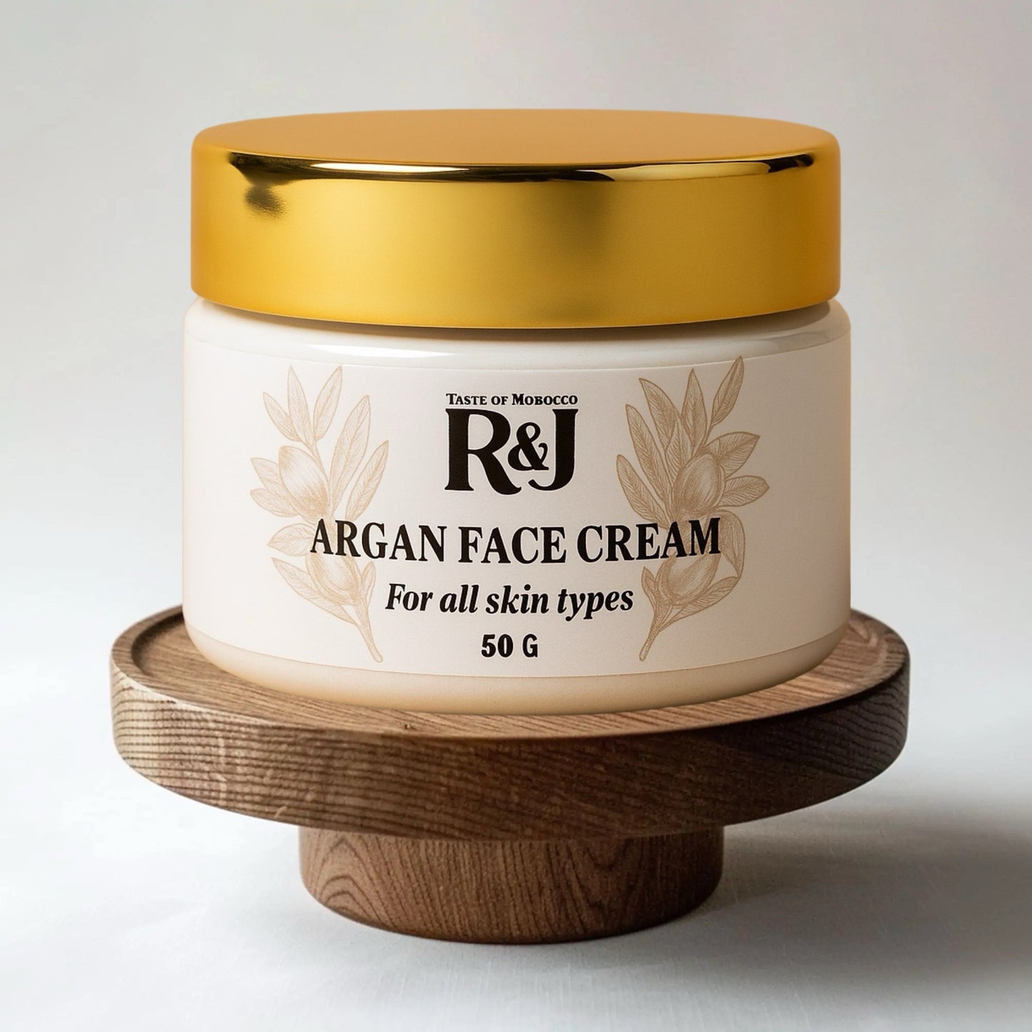 Jar of Moroccan Argan Face Cream on a wooden stand with a white background 